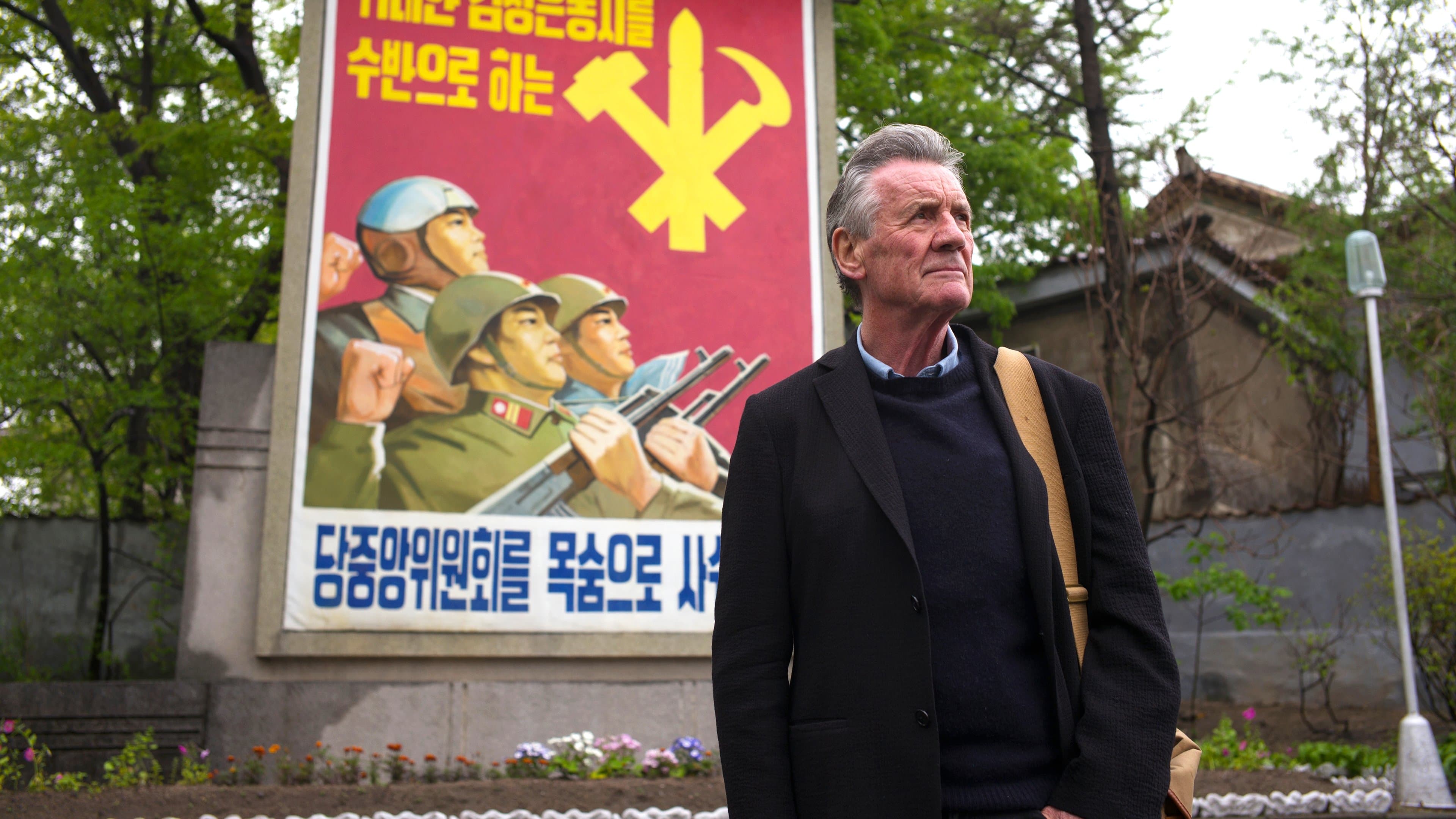 Michael Palin in North Korea backdrop
